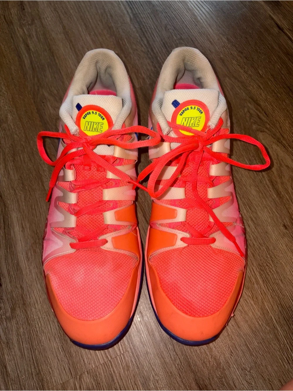 Nike Men's ' Pink/Coral Athletic Shoes with Blue Swoosh